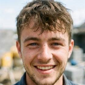 Portrait of a tile setter in a high-visibility shirt